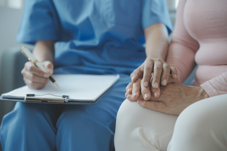 PTSD Mental health concept, Psychologist sitting and touch hand young depressed asian man for encouragement near window with low light environment.Selective focus.の写真素材