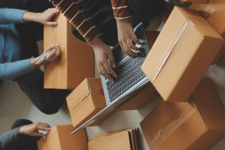 Business woman start up small business entrepreneur SME success .freelance woman working at home with Online Parcel delivery. SME and packaging deliveryconceptの写真素材
