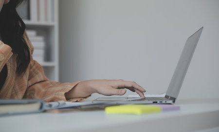 Financial analysts analyze business financial reports on a digital tablet planning investment...