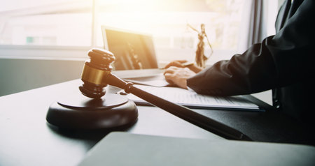 Business and lawyers discussing contract papers with brass scale on desk in office. Law, legal...