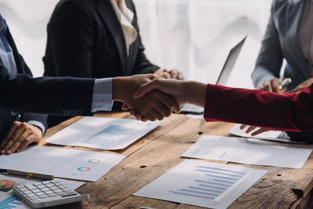 Brainstorming Collaboration and successful partnership analysis by Young business Asian people working in an office workspaceの写真素材