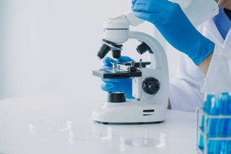 microscope with lab glassware, science laboratory research and development conceptの写真素材