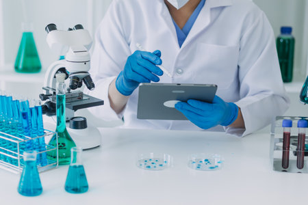 microscope with lab glassware, science laboratory research and development conceptの写真素材