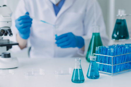 microscope with lab glassware, science laboratory research and development conceptの写真素材