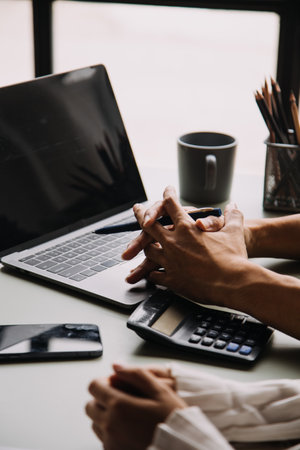 Financial Business team present. Business man hands hold documents with financial statistic stock photo, discussion, and analysis report data the charts and graphs. Finance Financial conceptの写真素材