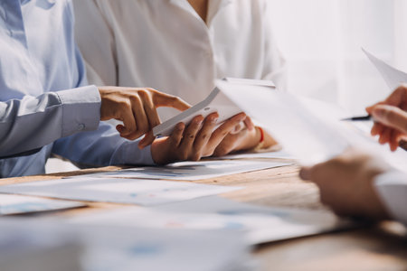 Group of Young Asian business team creative businesspeople coworker in office Happy to be successful partnership teamwork celebrating achievement and success concept.の写真素材