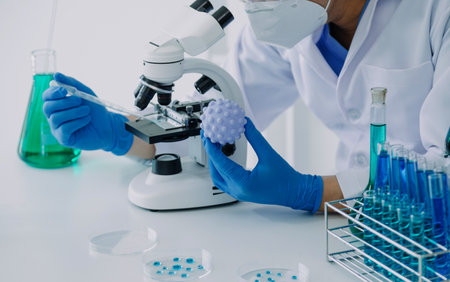 Medical Development Laboratory: Caucasian Female Scientist Looking Under Microscope, Analyzes Petri Dish Sample. Specialists Working on Medicine, Biotechnology Research in Advanced Pharma Labの写真素材