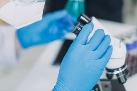 hand of scientist with test tube and flask in medical chemistry lab blue banner background