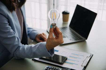 Inspiration. hand hold light bulb for good idea. brainstorming creative idea.の写真素材