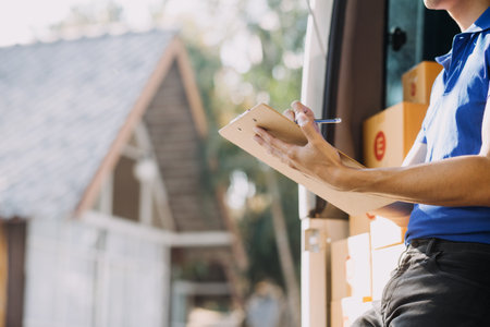 Business woman start up small business entrepreneur SME success .freelance woman working at home with Online Parcel delivery. SME and packaging deliveryconceptの写真素材