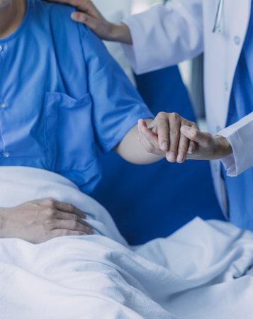 Asian caregiver doctor examine older patient use blood pressure gauge. Young woman therapist nurse at nursing home taking care of senior elderly woman sit on sofa. Medical insurance service conceptの写真素材
