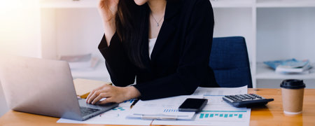 Close up of accountant working and analyzing financial reports project accounting with chart graph...