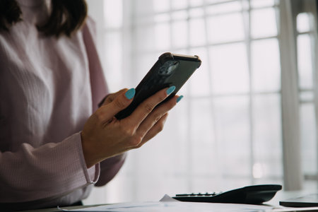 Creative Asian young woman working on laptop in her studioの写真素材