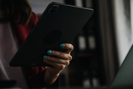 Creative Asian young woman working on laptop in her studioの写真素材