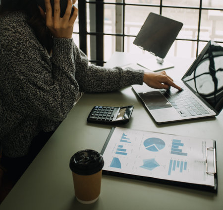 Creative Asian young woman working on laptop in her studioの写真素材