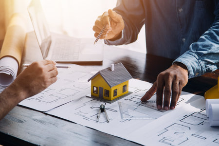 Construction and structure concept of engineer working drawing on blueprint meeting for project...