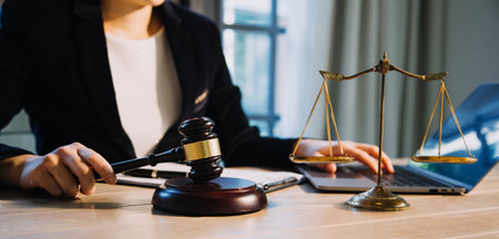 Justice and law concept.Male judge in a courtroom with the gavel, working with, computer and docking...