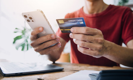 Businesswoman hands holding cradit card and using credit card online shopping. Online shopping conceptの写真素材
