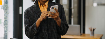 Entrepreneur Asian businessman and businesswoman discussing new business project in tablet in modern Meeting In Modern Office, Asian business casual concept.の写真素材