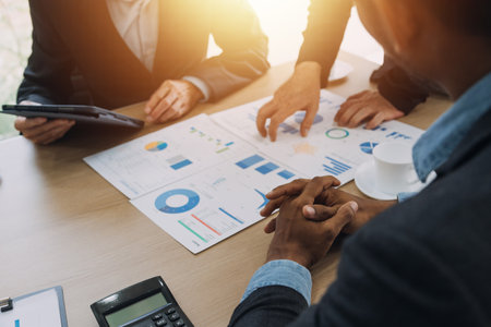 Teamwork with business people analysis cost graph on desk at meeting room.の写真素材