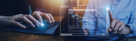 Businessman analyzing business Enterprise data management, business analytics with charts, metrics and KPIs to improve organizational performance, marketing, financial organization strategy.の写真素材