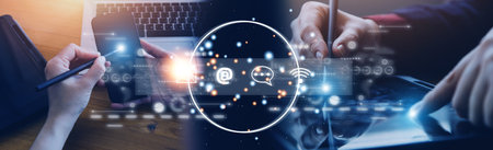 Contact us or Customer support hotline people connect. Businessman using a laptop and touching on...