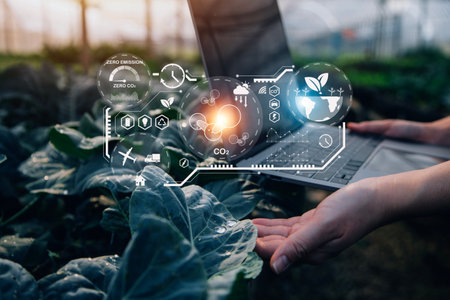 Smart farmer using application by tablet concepts modern vegetables and gardening lettuce at...