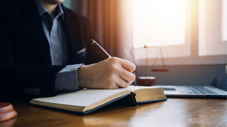 Justice and law concept.Male judge in a courtroom with the gavel, working with, computer and docking...