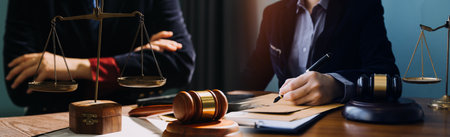 Business and lawyers discussing contract papers with brass scale on desk in office. Law, legal...