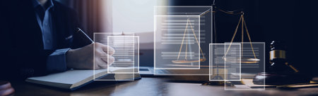 Business and lawyers discussing contract papers with brass scale on desk in office. Law, legal services, advice, justice and law concept picture with film grain effectの写真素材