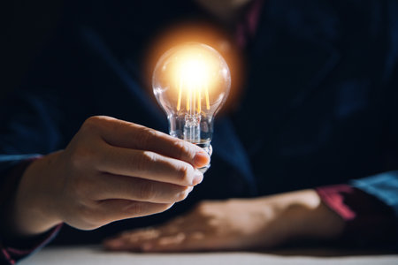 Creative new idea. Innovation, brainstorming, inspiration and solution concepts. The man is holding...