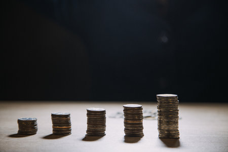 Money, Financial, Business Growth concept, Man's hand put money coins to stack of coinsの写真素材