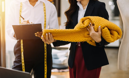 Fashion designer working in studio. Close up design.の写真素材