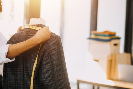 Fashion designer working in studio. Close up design.の写真素材