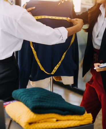 Fashion designer working in studio. Close up design.の写真素材