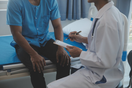 Doctors do it for the health of it. Shot of a mature doctor examining his patient who is concerned about his knee.の写真素材