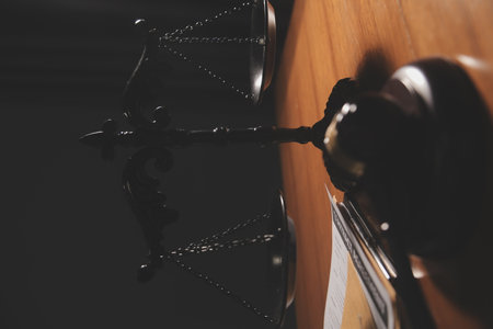 Business and lawyers discussing contract papers with brass scale on desk in office. Law, legal services, advice, justice and law concept picture with film grain effectの写真素材