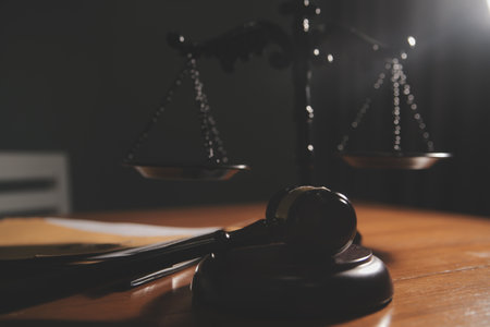 Business and lawyers discussing contract papers with brass scale on desk in office. Law, legal...