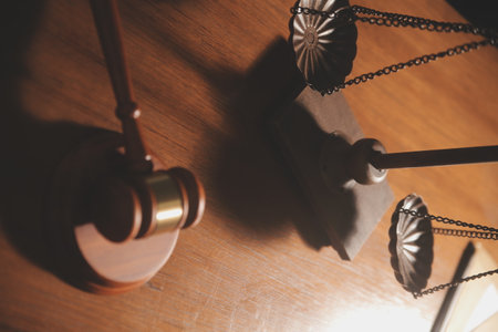 Business and lawyers discussing contract papers with brass scale on desk in office. Law, legal...