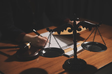 Business and lawyers discussing contract papers with brass scale on desk in office. Law, legal...