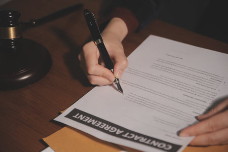 Business and lawyers discussing contract papers with brass scale on desk in office. Law, legal...