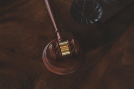 Justice and law concept.Male judge in a courtroom with the gavel, working with, computer and docking...