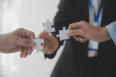 Cropped shot of Businesswoman hand connecting jigsaw puzzle with sunlight effect, Business...