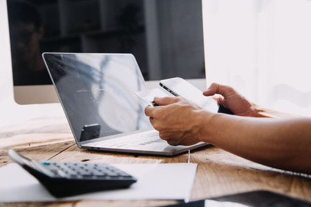 Businesswoman hands holding cradit card and using credit card online shopping. Online shopping...