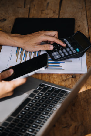 Business Man Financial Inspector and Secretary Making Report, Calculating or Checking Balance. Internal Revenue Service Inspector Checking Document Audit Conceptの写真素材