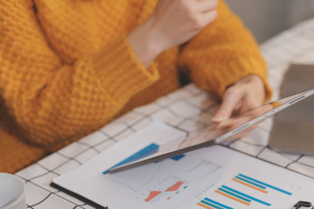 Cropped photo of Freelancer business Asian woman holding coffee cup and at doing planning analyzing...