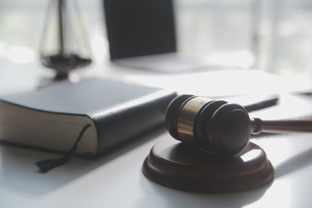 Business and lawyers discussing contract papers with brass scale on desk in office. Law, legal...