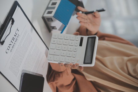 Real estate agent and customer signing contract to buy house, insurance or loan real estate.rent a house,get insurance or loan real estate or property.の写真素材