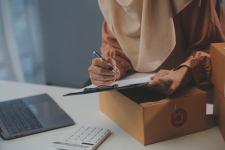 Starting small businesses SME owners female entrepreneurs Write the address on receipt box and check...
