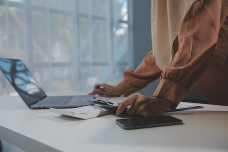 Starting small businesses SME owners female entrepreneurs Write the address on receipt box and check online orders to prepare to pack the boxes, sell to customers, sme business ideas online.の写真素材